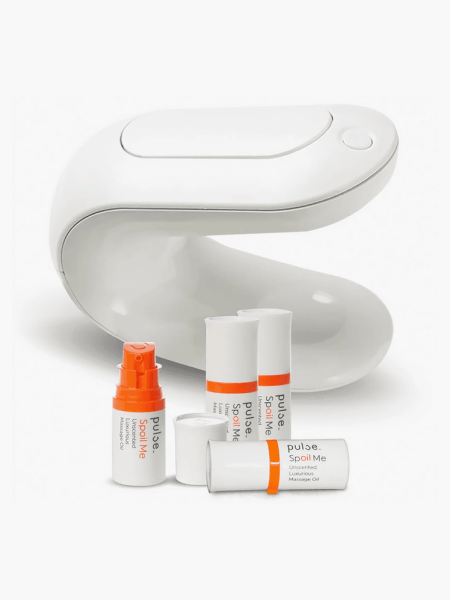 Pulse Personal Lube and Massage Oil Warming Dispenser in white and orange color way on light gray background